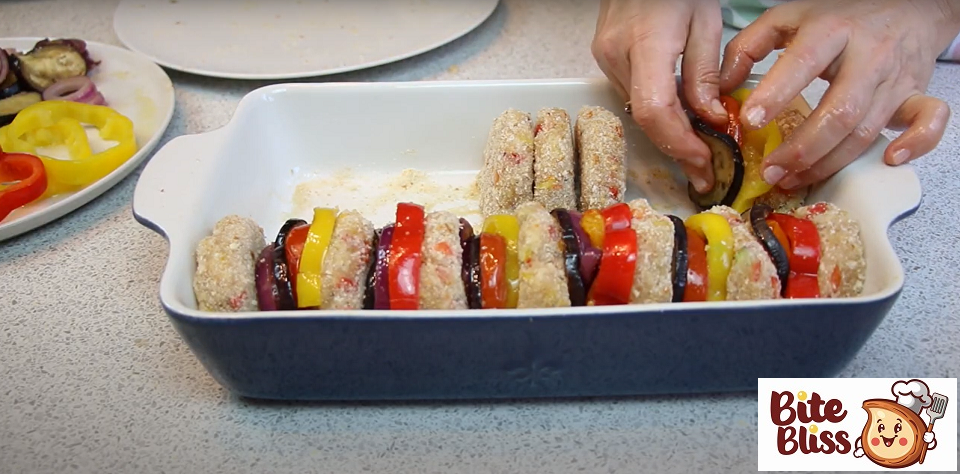 Lay out the cutlets and cover with roasted vegetables