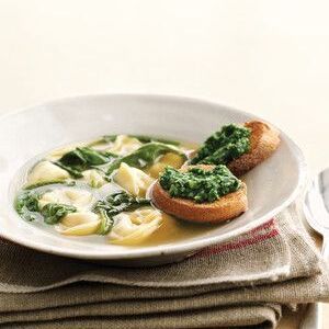 Meat Tortellini in Broth with Arugula and Pesto Toasts