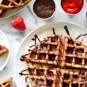 Churro Waffles with Caramel, Chocolate, and Strawberry Sauces