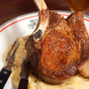 The Inevitable Pork Chop With Cheddar Grits From 'The Meat Hook Meat Book'